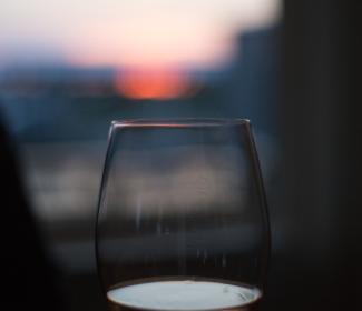 a glass of wine looking at the sunset in Gulf Shores AL