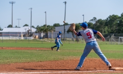 Baseball player catching a ball on Alabama's Beaches