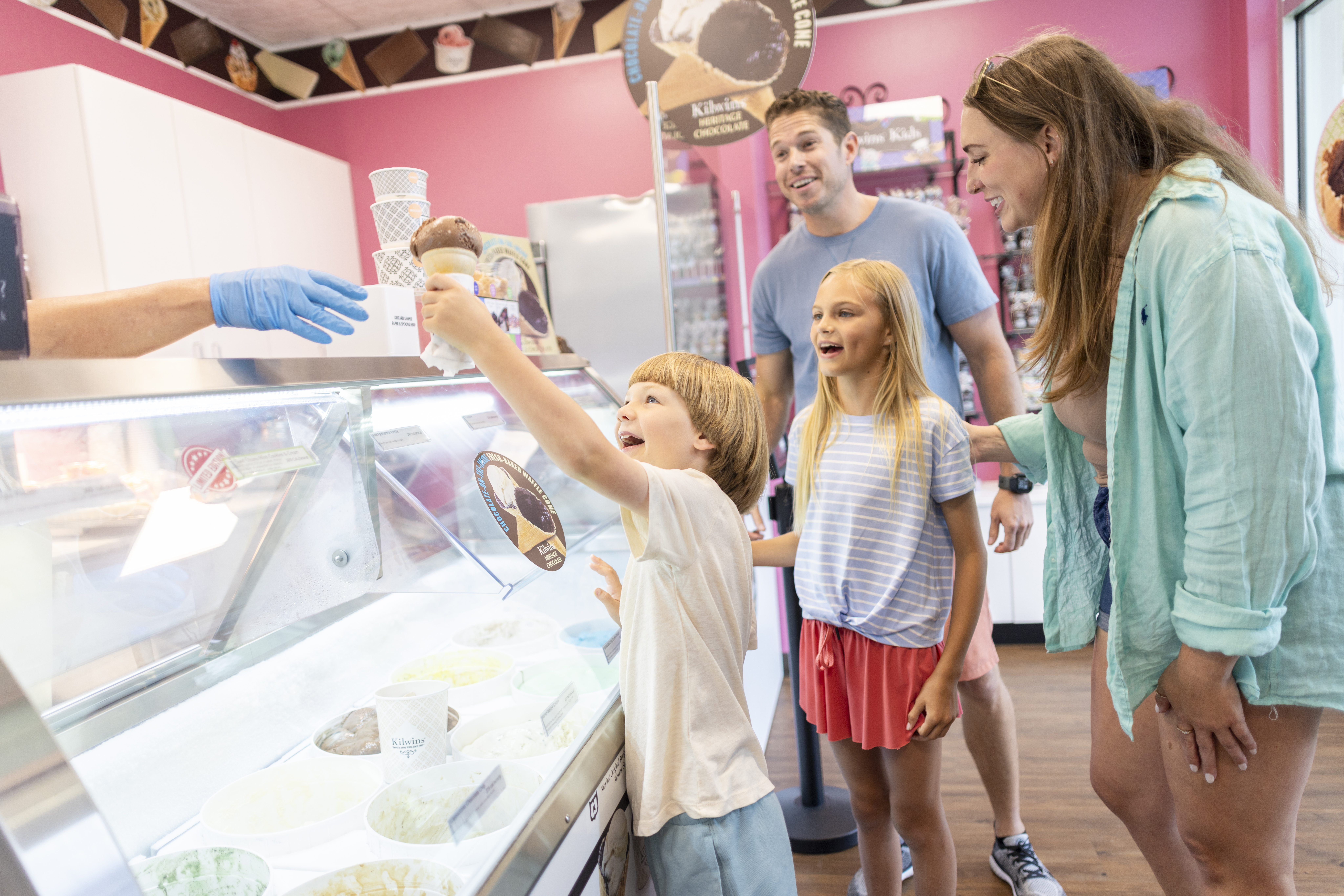 A family getting ice cream at a local ice cream parlor
