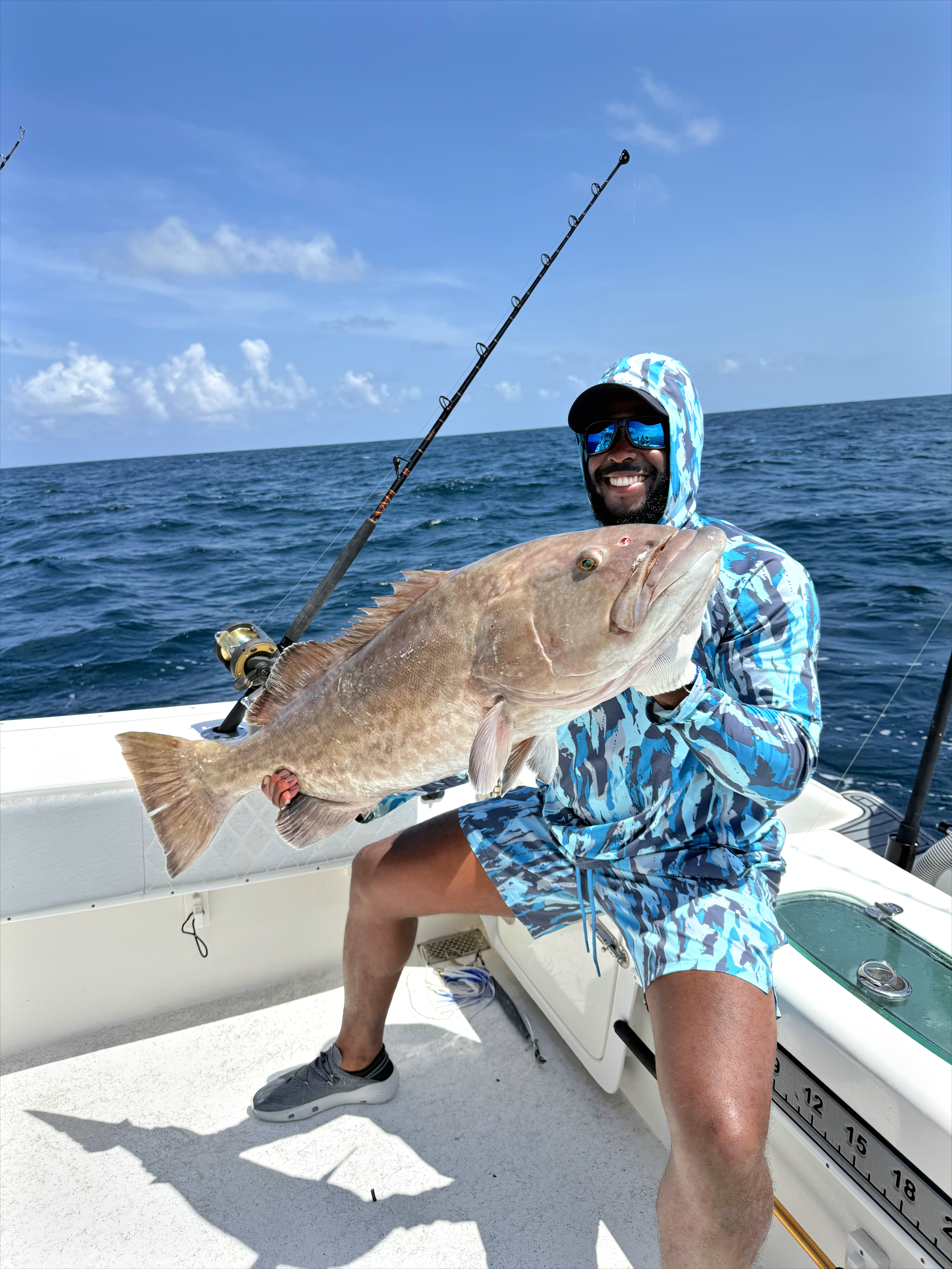 Man with the Gag Grouper he caught on Alabama's Beaches
