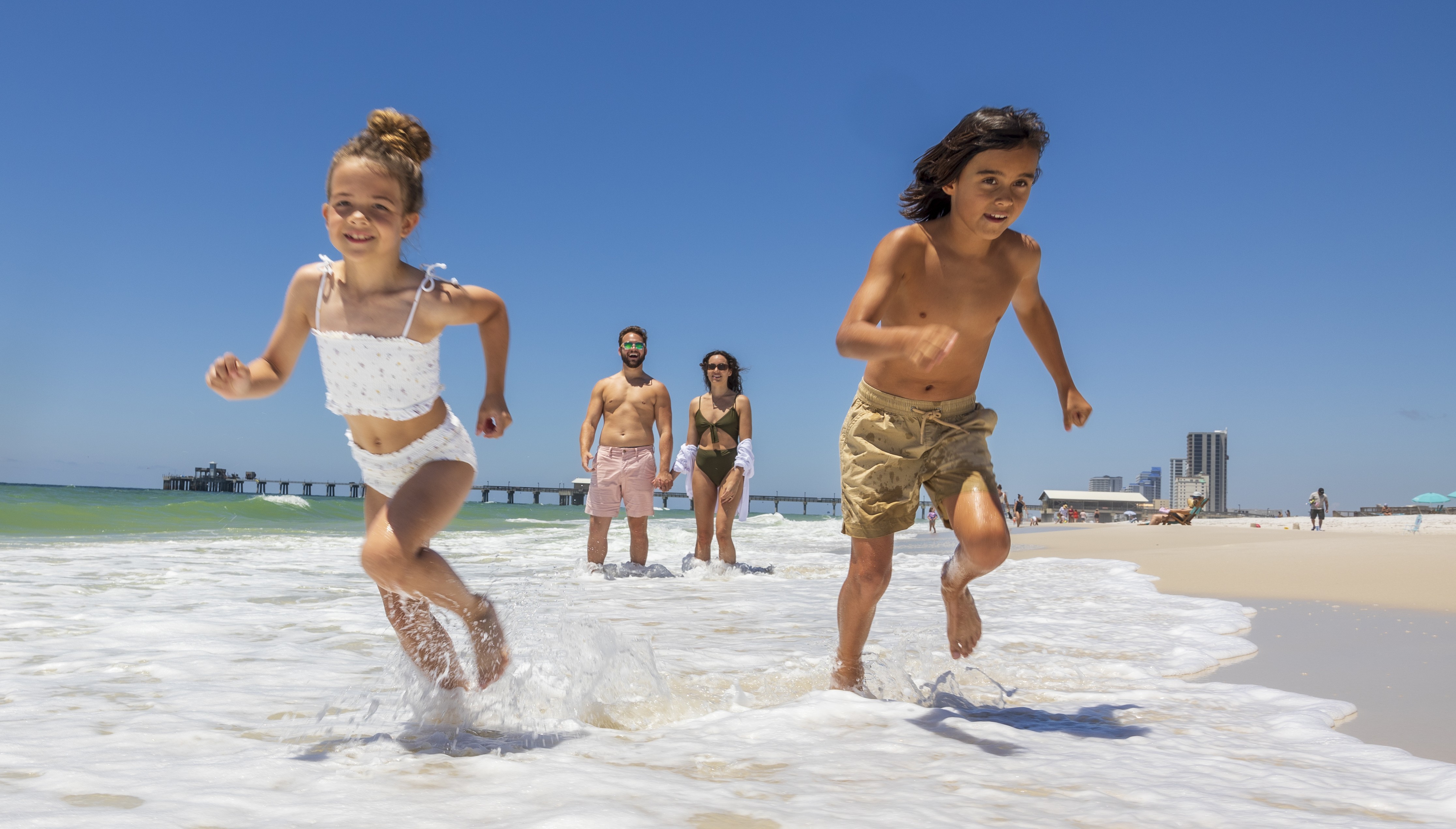 kids running along Alabama's Beaches