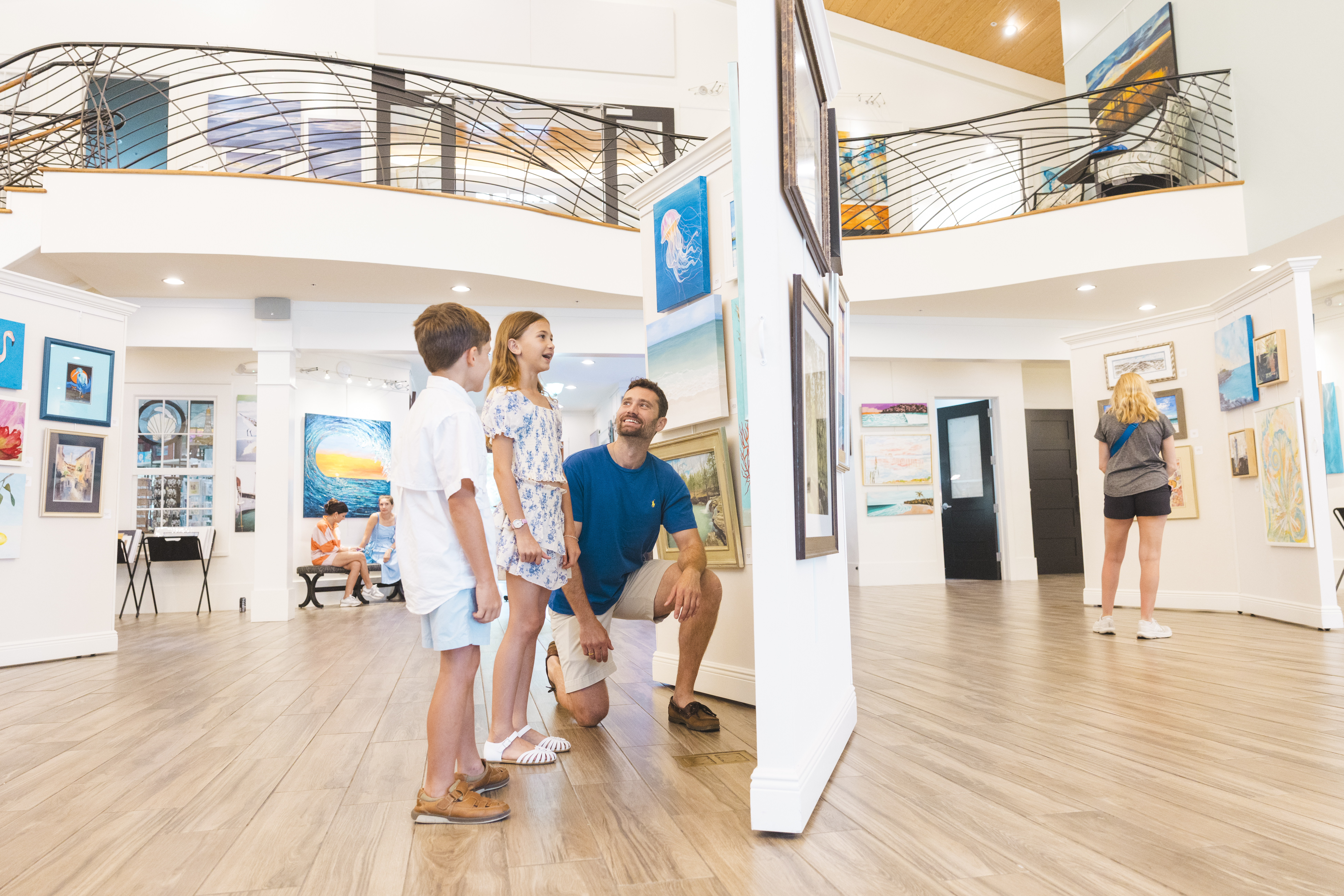 A family visiting the Coastal Arts Center of Orange Beach