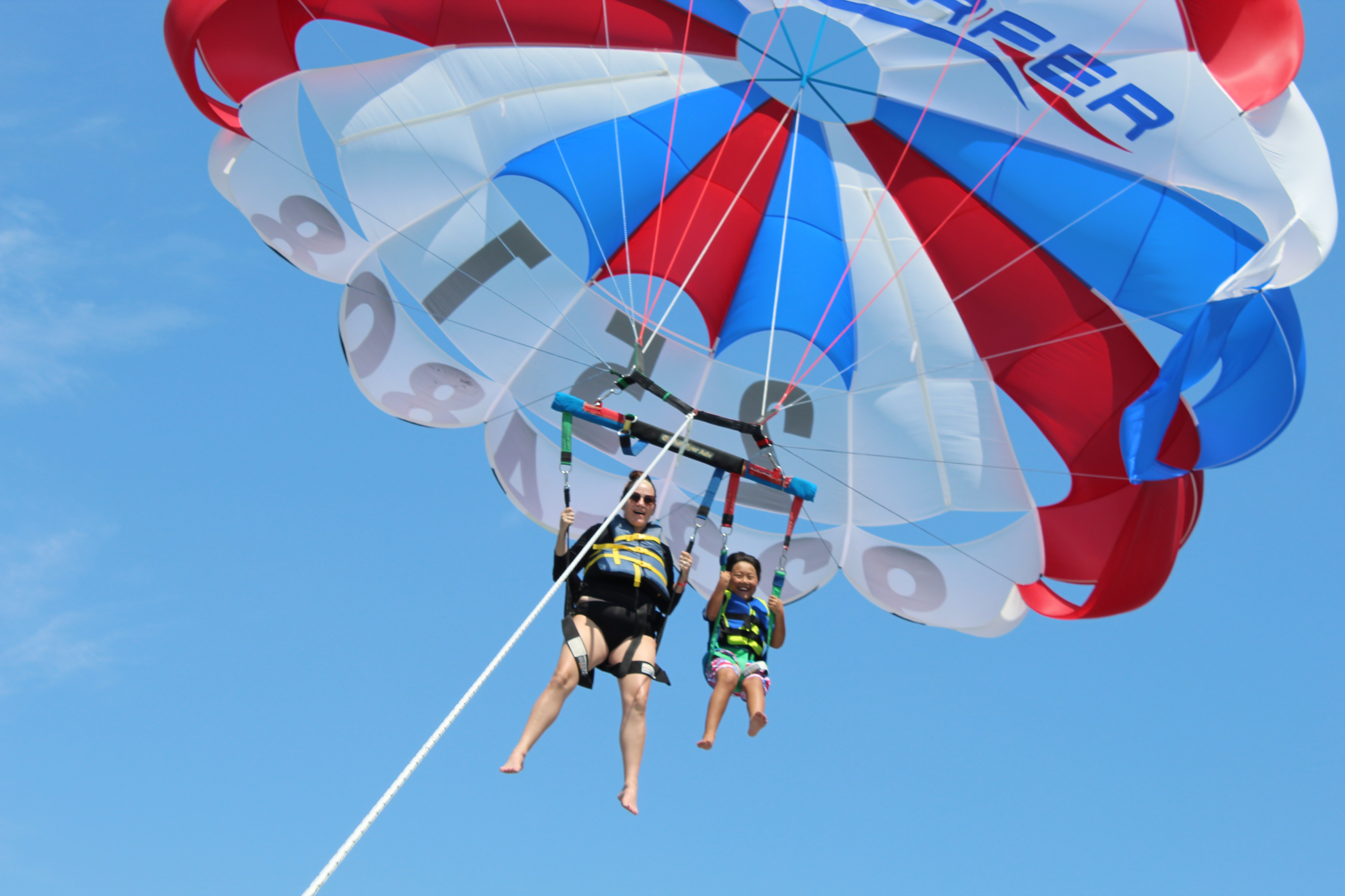 Mom and son parasailing in Orange Beach, AL