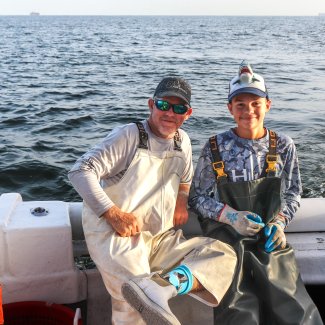 Captain and angler on a shark fishing trip with Apex Charters in Orange Beach