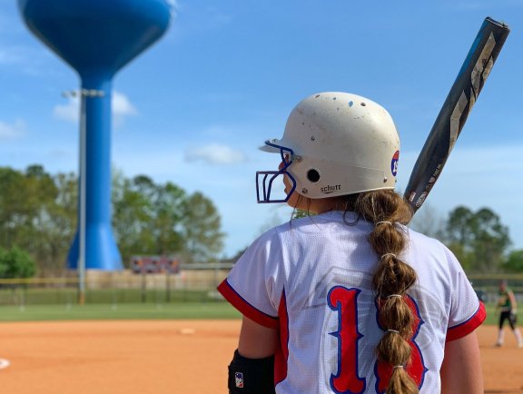 Softball player competing on the Alabama Gulf Coast