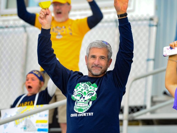 Dad cheering daughter on during NAIA Women's Soccer Championship in Gulf Shores, AL