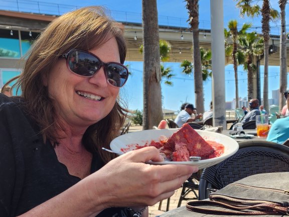 Sara Broers with bread pudding at Cobalt, waterfront restaurant in Orange Beach