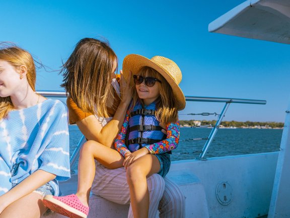Family enjoying a dolphin cruise tour in Orange Beach