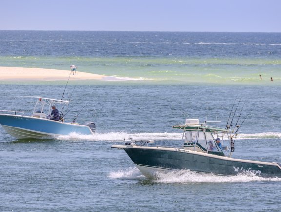 Boats cruising through Perdido Pass in Orange Beach