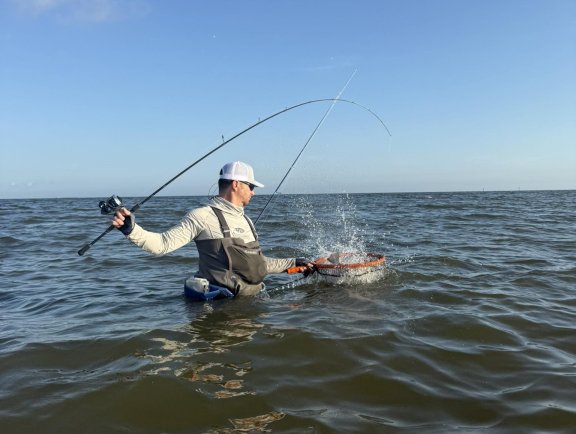 Angler wade fishing in the Gulf in Orange Beach, AL