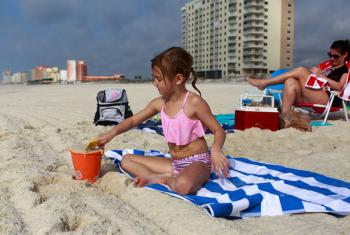 Girl playing on the beach, Gulf Shores and Orange Beach, AL