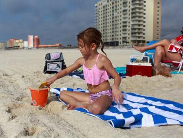 Girl playing on the beach, Gulf Shores and Orange Beach, AL