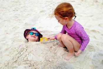 Kids play in sand at Beach in Gulf Shores AL