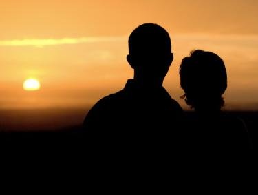 Couple at sunset Orange Beachk