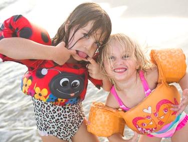 Girls playing on the beach