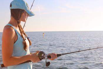 Woman fishing in Orange Beach