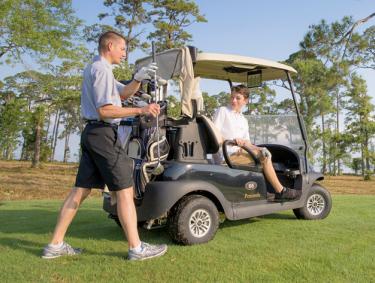 Teen golfing with Dad in Gulf Shores
