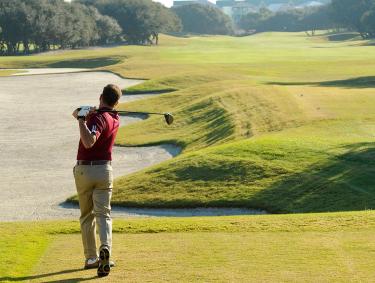 Man golfing at Kiva Dunes in Gulf Shores, AL