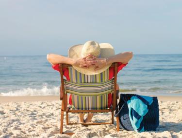 Woman relaxing on the beach in Alabama