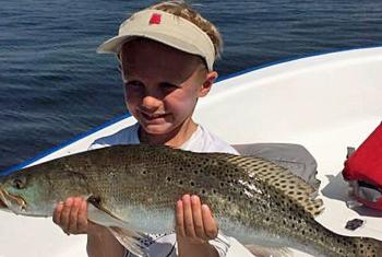Little boy with a big trout in Gulf Shores, AL