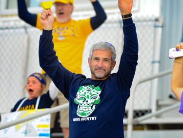 Dad cheering daughter on during NAIA Women's Soccer Championship in Gulf Shores, AL