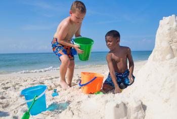 Boys playing on Alabama's Beaches