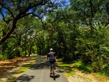 Man biking on trails in Gulf Shores, AL