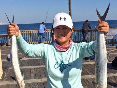 Woman with Spanish mackerel catches on Alabama's beaches