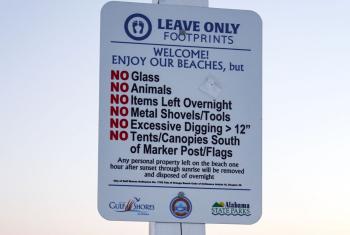 Leave Only Footprints Sign on Beach