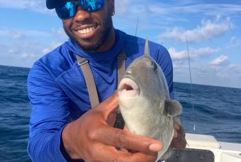 Man holding triggerfish in Gulf of Mexico 