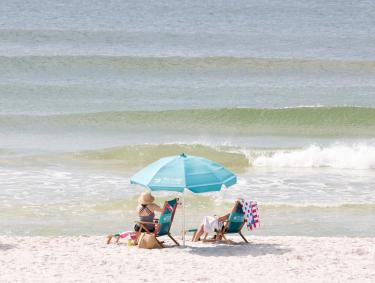 Beach chairs and umbrellas on the beach at The Lodge