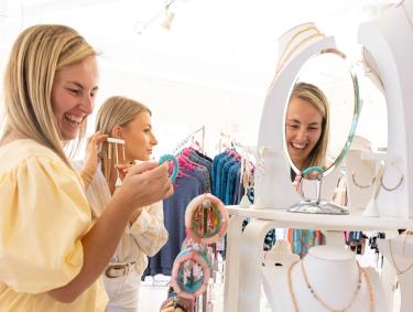 Women shopping for jewelry at San Roc Cay, shopping center in Orange Beach