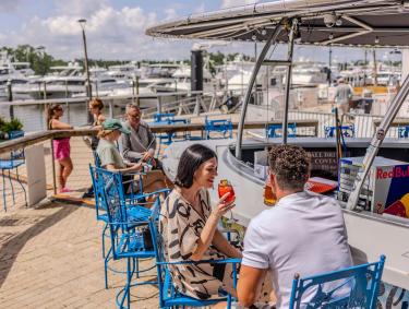 People sitting at the boat bar at Yoho Rum & Tacos
