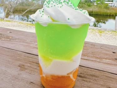 Orange, white, and green St. Patrick's Day daiquiri at High Tide Daiquiris & Mimosas in Gulf Shores