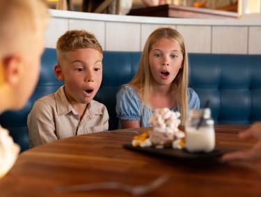 Kids marveling at dessert at Jesse's on the Bay restaurant in Fort Morgan