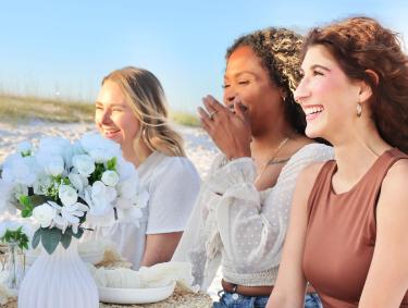 Girlfriends having a beachfront picnic in Orange Beach