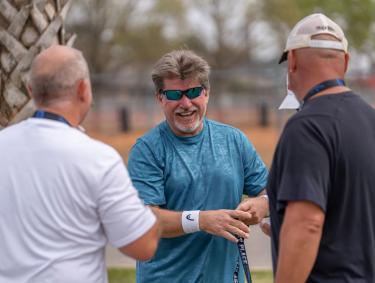 pickleball players chatting at a pickleball tournament in gulf shores