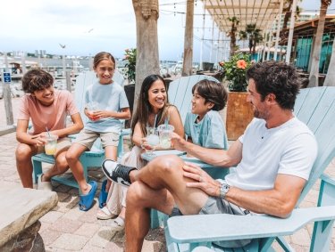 Family dining at Cobalt waterfront restaurant in Orange Beach