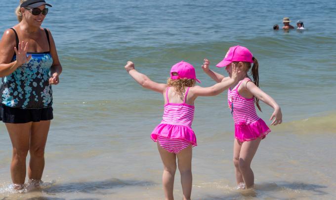 little girls playing on the beach
