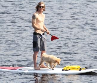 man and dog on paddle board Orange Beach AL