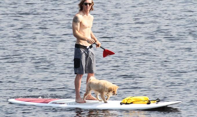 man and dog on paddle board Orange Beach AL