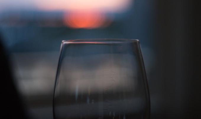 a glass of wine looking at the sunset in Gulf Shores AL