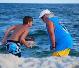 Grandson and Grandfather on the beach in Orange Beach Al