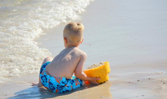 Boy playing on beach