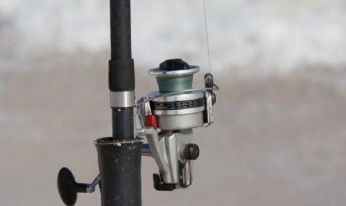 rod and reel on the beach in Gulf Shores AL