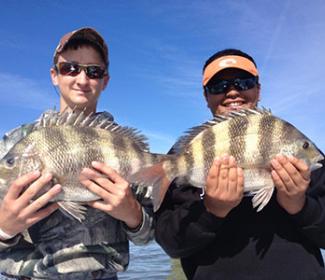 2 Men holding Gulf Coast catch