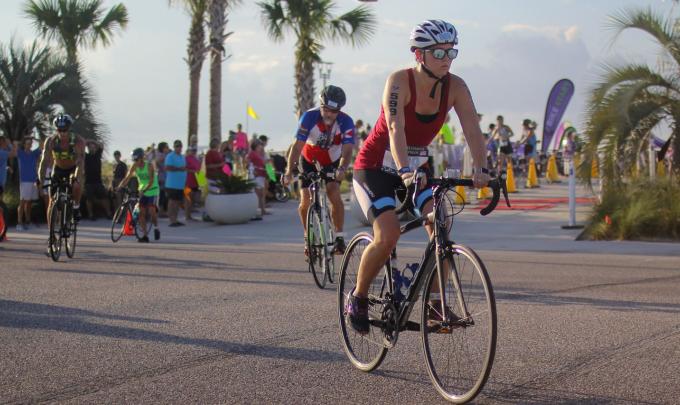 Participants bike to the finish at a past Brett-Robinson Coastal Triathlon.