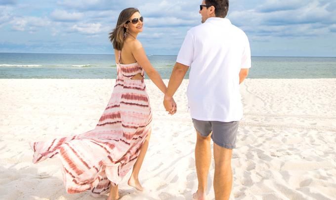 Couple walking on Alabama's Beaches