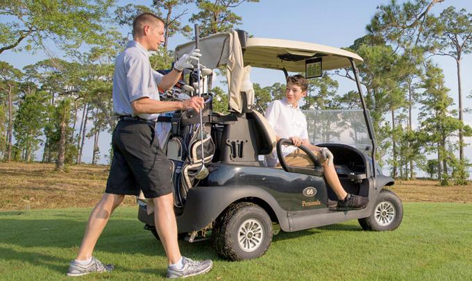 Teen golfing with Dad in Gulf Shores