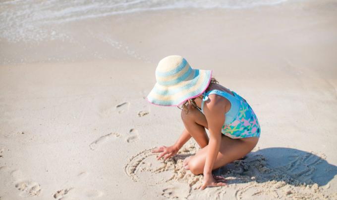 Young girl playing in the sand Gulf Shores, AL